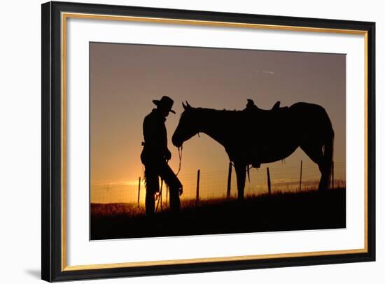 Cowboy Standing with His Horse-Darrell Gulin-Framed Photographic Print