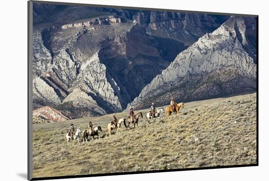 Cowboys and Cowgirls Riding along the Hills of the Big Horn Mountains-Terry Eggers-Mounted Photographic Print