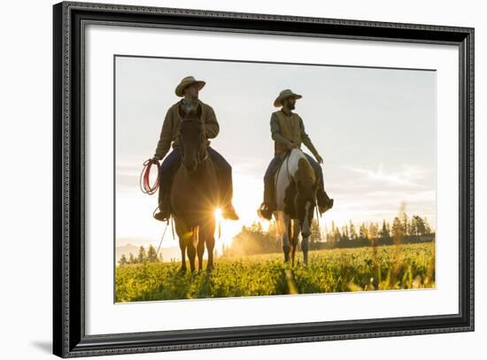 Cowboys Riding across Grassland with Moutains Behind, Early Morning, British Colombia, B.C., Canada-Peter Adams-Framed Photographic Print