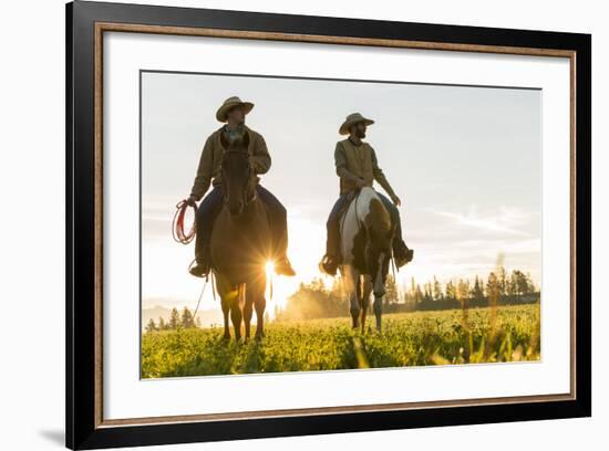 Cowboys Riding across Grassland with Moutains Behind, Early Morning, British Colombia, B.C., Canada-Peter Adams-Framed Photographic Print