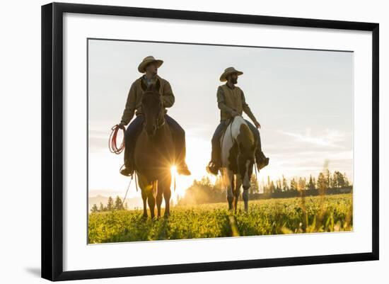 Cowboys Riding across Grassland with Moutains Behind, Early Morning, British Colombia, B.C., Canada-Peter Adams-Framed Photographic Print