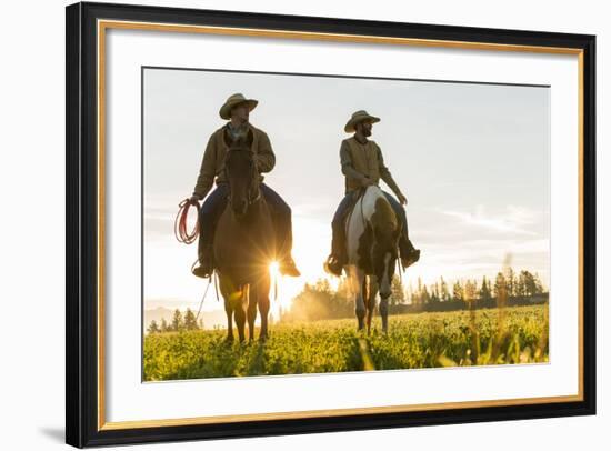 Cowboys Riding across Grassland with Moutains Behind, Early Morning, British Colombia, B.C., Canada-Peter Adams-Framed Photographic Print