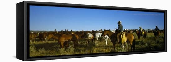 Cowboys Riding Horses in a Field-null-Framed Premier Image Canvas