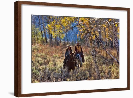 Cowgirl and Cowboy Riding Together-Terry Eggers-Framed Photographic Print