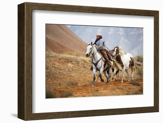 Cowgirl at Full Gallop with Horses in Tow-Terry Eggers-Framed Photographic Print