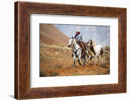 Cowgirl at Full Gallop with Horses in Tow-Terry Eggers-Framed Photographic Print