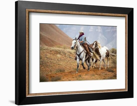 Cowgirl at Full Gallop with Horses in Tow-Terry Eggers-Framed Photographic Print