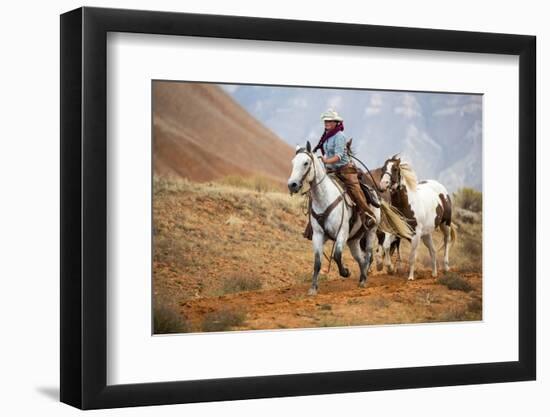 Cowgirl at Full Gallop with Horses in Tow-Terry Eggers-Framed Photographic Print