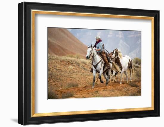 Cowgirl at Full Gallop with Horses in Tow-Terry Eggers-Framed Photographic Print