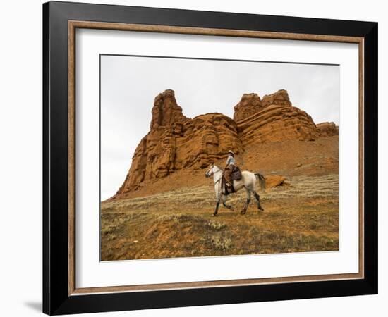 Cowgirl at Full Gallop with Red Rock Hills-Terry Eggers-Framed Photographic Print