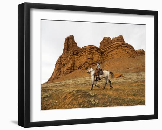 Cowgirl at Full Gallop with Red Rock Hills-Terry Eggers-Framed Photographic Print