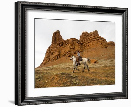 Cowgirl at Full Gallop with Red Rock Hills-Terry Eggers-Framed Photographic Print