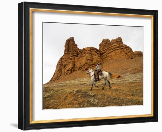 Cowgirl at Full Gallop with Red Rock Hills-Terry Eggers-Framed Photographic Print