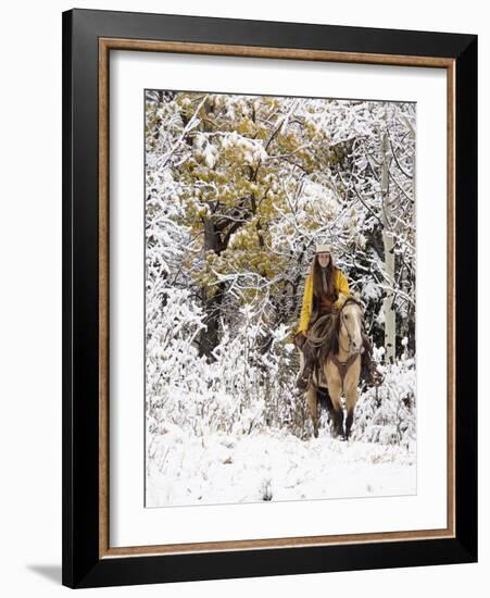 Cowgirl Riding in Autumn Aspens with a Fresh Snowfall-Terry Eggers-Framed Photographic Print