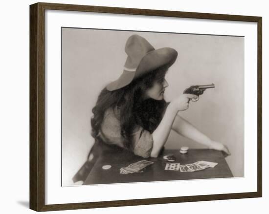 Cowgirl with Deck of Cards and Chips, Pointing a Pistol, 1912-null-Framed Photo
