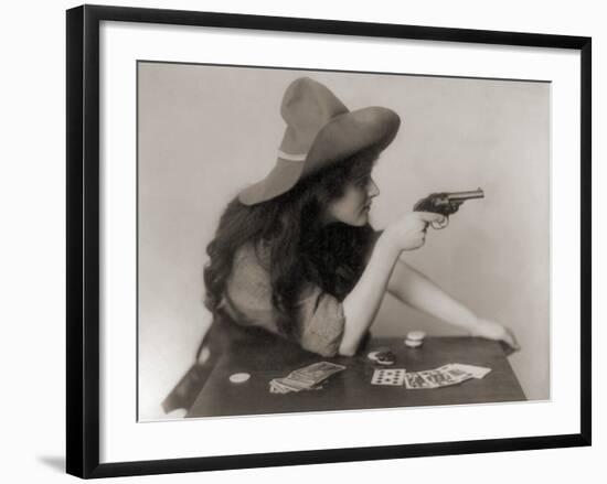 Cowgirl with Deck of Cards and Chips, Pointing a Pistol, 1912-null-Framed Photo