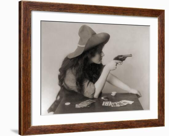 Cowgirl with Deck of Cards and Chips, Pointing a Pistol, 1912-null-Framed Photo