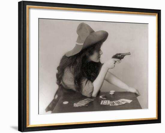 Cowgirl with Deck of Cards and Chips, Pointing a Pistol, 1912-null-Framed Photo