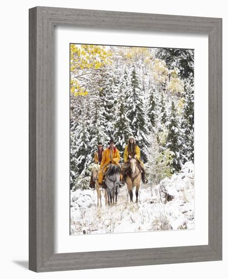 Cowgirls and Cowboy Riding in Autumn Aspens with a Fresh Snowfall-Terry Eggers-Framed Photographic Print