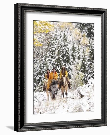 Cowgirls and Cowboy Riding in Autumn Aspens with a Fresh Snowfall-Terry Eggers-Framed Photographic Print