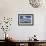 Cows Graze in Front of a Lighthouse in Bastorf, Germany-Bernd Wuestneck-Framed Photo displayed on a wall