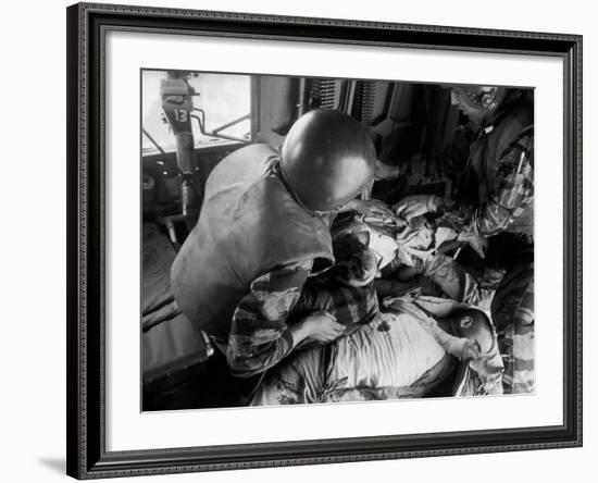 Cpl. James Farley and Pfc. Wayne Hoilien Bandaging Sgt. Billie Owens' Shoulder, Yankee Papa 13-Larry Burrows-Framed Photographic Print