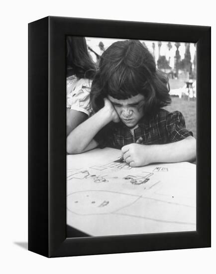 Crayon Artist Working at Her Drawing-Ed Clark-Framed Premier Image Canvas