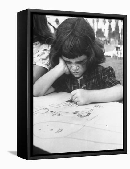 Crayon Artist Working at Her Drawing-Ed Clark-Framed Premier Image Canvas