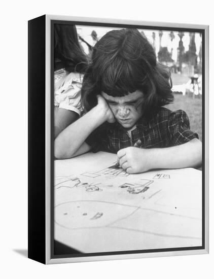 Crayon Artist Working at Her Drawing-Ed Clark-Framed Premier Image Canvas