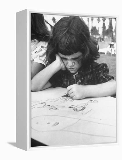 Crayon Artist Working at Her Drawing-Ed Clark-Framed Premier Image Canvas