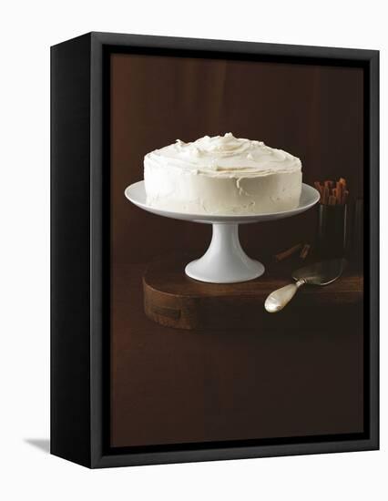 Cream Layer Cake on a Cake Stand Next to a Pot of Cinnamon Sticks - Conde Nast Collection-null-Framed Premier Image Canvas