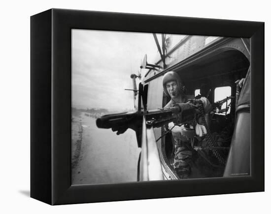 Crew Chief Lance Cpl. James C. Farley Manning Helicopter Machine Gun of Yankee Papa 13-Larry Burrows-Framed Premier Image Canvas