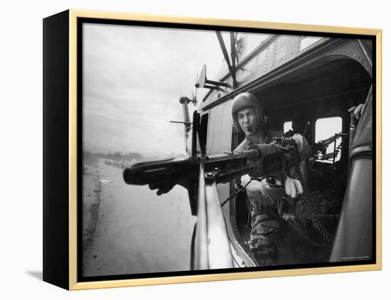 Crew Chief Lance Cpl. James C. Farley Manning Helicopter Machine Gun of Yankee Papa 13-Larry Burrows-Framed Premier Image Canvas