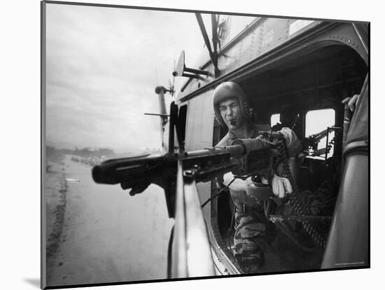 Crew Chief Lance Cpl. James C. Farley Manning Helicopter Machine Gun of Yankee Papa 13-Larry Burrows-Mounted Photographic Print