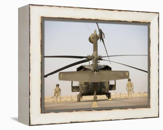 Crew Chiefs Stand Beside their UH-60L Black Hawk Helicopter-null-Framed Premier Image Canvas