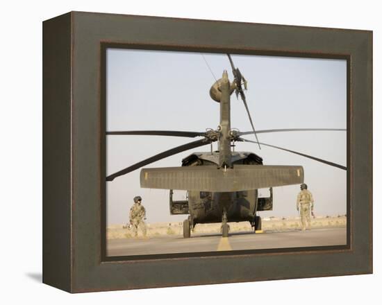 Crew Chiefs Stand Beside their UH-60L Black Hawk Helicopter-null-Framed Premier Image Canvas