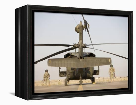 Crew Chiefs Stand Beside their UH-60L Black Hawk Helicopter-null-Framed Premier Image Canvas