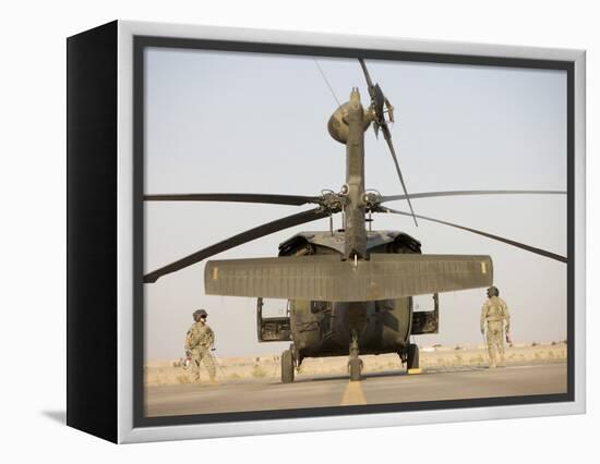 Crew Chiefs Stand Beside their UH-60L Black Hawk Helicopter-null-Framed Premier Image Canvas