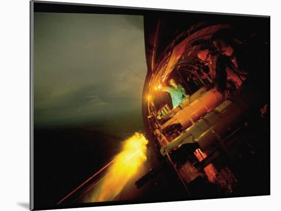 Crew of American AC47 Gunship Firing 7.62 MM Miniguns on a Night Mission During the Vietnam War-Larry Burrows-Mounted Photographic Print