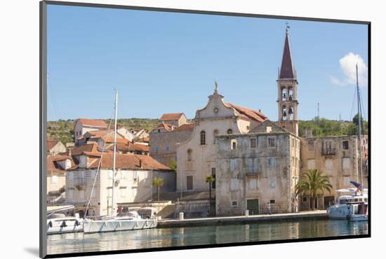 Croatia, Brac, Milna. Church of our Lady of the Annunciation 18th century dominates waterfront.-Trish Drury-Mounted Photographic Print
