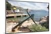 Croatia, Dubrovnik. Ferry dock Lokrum Island framed by old anchor.-Trish Drury-Mounted Photographic Print