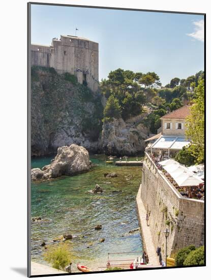 Croatia, Dubrovnik. Restaurant outside walled old city. St. Lawrence Fort.-Trish Drury-Mounted Photographic Print