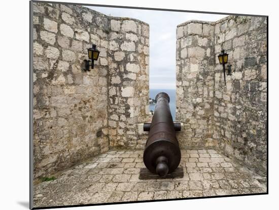 Croatia, Hvar. Cannon overlooking the town and coastline from Hvar Fortica or Spanjola Fortress.-Julie Eggers-Mounted Photographic Print