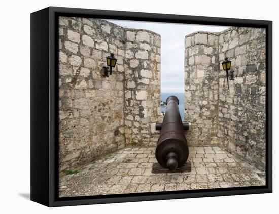 Croatia, Hvar. Cannon overlooking the town and coastline from Hvar Fortica or Spanjola Fortress.-Julie Eggers-Framed Premier Image Canvas