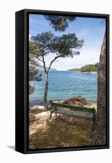 Croatia, Hvar Island, Stari Grad. Picturesque waterfront spot for bench.-Trish Drury-Framed Premier Image Canvas