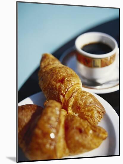 Croissant and Black Coffee on Table, St. Martin, Caribbean-Greg Johnston-Mounted Photographic Print