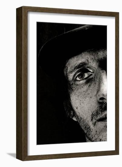 Cropped Portrait of a Man with Hat Starring into the Camera-Torsten Richter-Framed Photographic Print