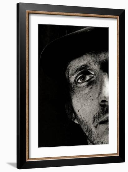 Cropped Portrait of a Man with Hat Starring into the Camera-Torsten Richter-Framed Photographic Print