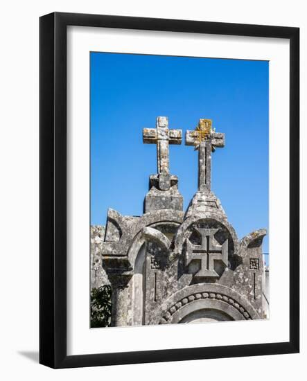 Cross at the top of an ancient gravestone in the cemetery at the Castelo de Ourem, Portugal.-Julie Eggers-Framed Photographic Print