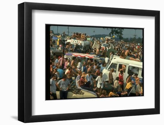 Crowd of people, some Sitting on Top of Cars and Busses, During the Woodstock Music/Art Fair-John Dominis-Framed Photographic Print